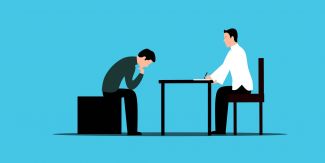 Disegno raffigurante l'attività di counseling: consigliere e persona di fronte a lui alla scrivania