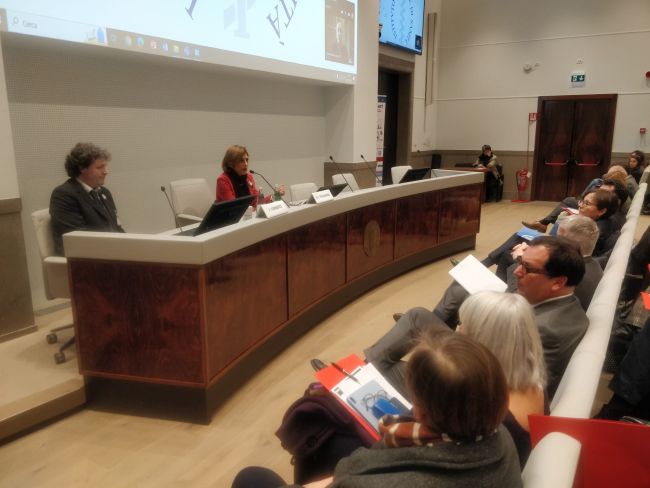 Il tavolo dei relatori dell'1NF-ACT Meeting con Federico Forneris (UniPv) e Anna Teresa Palamara (Università di Roma Sapienza)