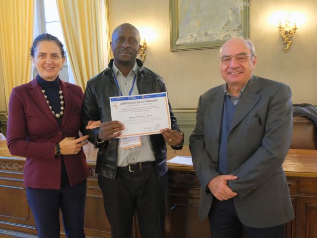 Beatus Modesty Lyimo from the Nelson Mandela University (Tanzania) receives his certificate of attendance
