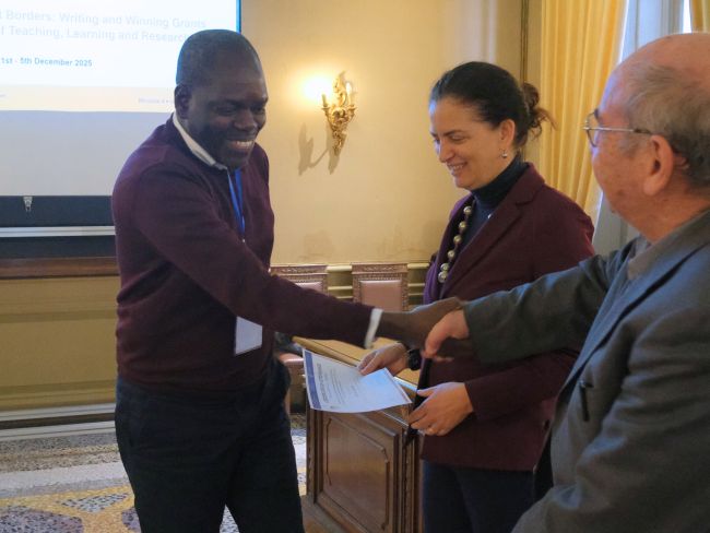 Magatte Camara from Assane Seck de Ziguinchor University (Senegal) receives his certificate of attendance