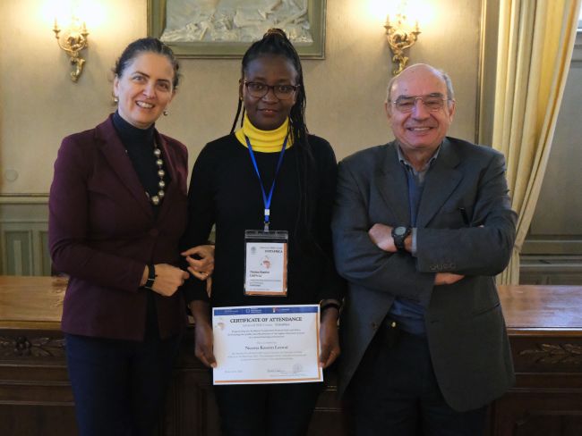 Neema Kassim Laswai from the Nelson Mandela University (Tanzania) receives her certificate of attendance